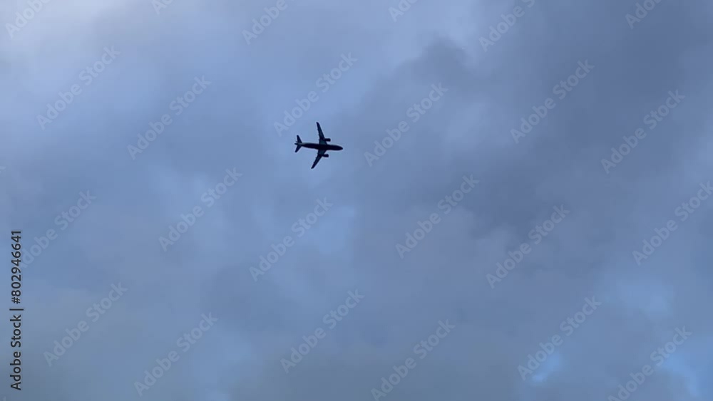 Jet airplane extreme low angle view shot from the cockpit of another plane. Clouded winter sky. 4K 60FPS Jet airplane extreme low angle view shot from the cockpit of another plane. Clouded winter sky. 4K 60FPS