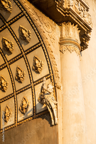 details of thai art patterns on ceremonial archway in vientiane laos photo