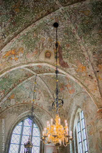 Beautiful paintings and lamp. Interior or Saint Petri church, Malmo