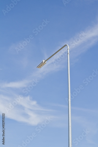 Street light pole on blue sky