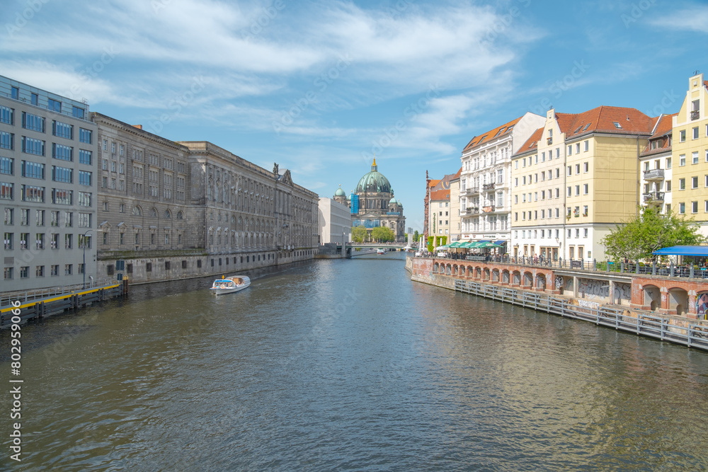 Fototapeta premium City canal with historic buildings and pedestrian bridge, Berlin, Germany, Europe