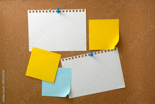 Blank sticky note paper on cork board wall. Noticeboard to organize life and work concept