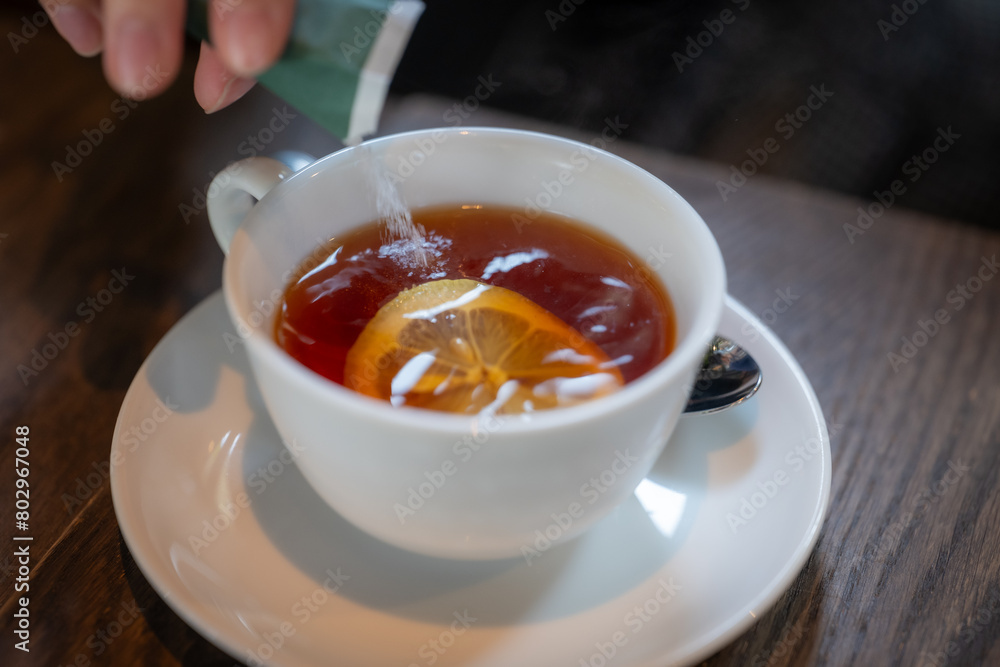 A cup of coffee with lemon and sugar. A cup of coffee with lemon and sugar.