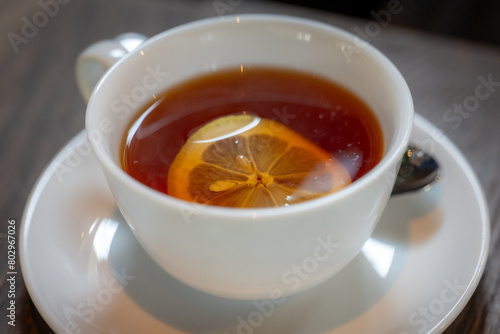 A cup of coffee with lemon