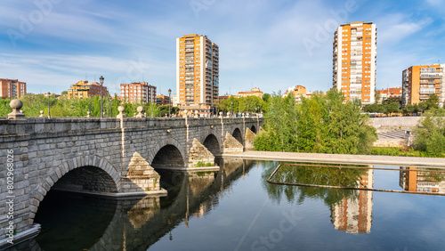 Skyline of the city of Madrid next to the bridge that crosses the Manzanares River to the south of the city. photo