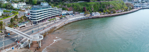 Torquay seafront aerial panorama image. English riviera with cafe's, bars.Torquay marina in the background with boats and yachts . Princess theatre.