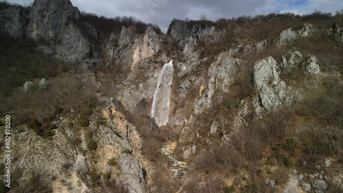 Skakavica waterfall among the rocks of wild Montenegro nature. A popular tourist destination photo