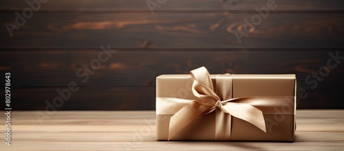 A brown gift box with a rib...