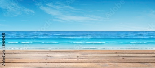 A beach themed copy space image on a blue wooden background representing the concept of travel