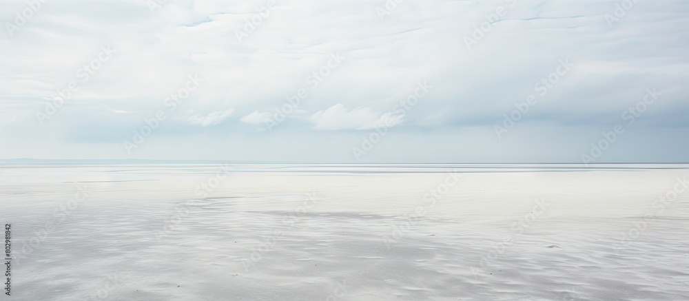 A chilly and breezy day at the expansive beach of Sankt Peter Ording in the German Wadden Sea featuring a captivating copy space image