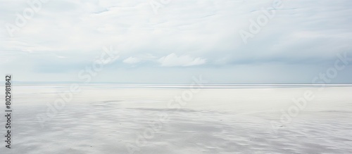 A chilly and breezy day at the expansive beach of Sankt Peter Ording in the German Wadden Sea featuring a captivating copy space image photo