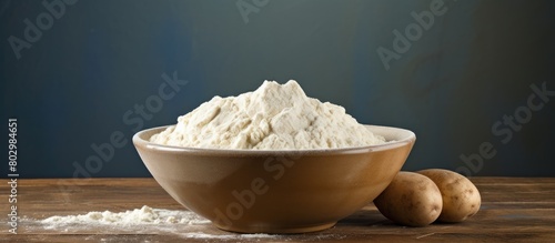 A bowl filled with potato flour with ample space for copy images