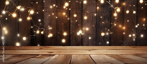 A copy space image featuring enchanting fairy lights against a rustic wooden backdrop