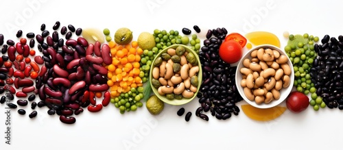 A copy space image featuring a variety of mixed beans including chickpeas kidney beans and black beans arranged on a white background photo