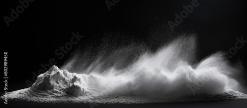 A black background hosts a striking image of white chalk powder providing copy space for textures or messages