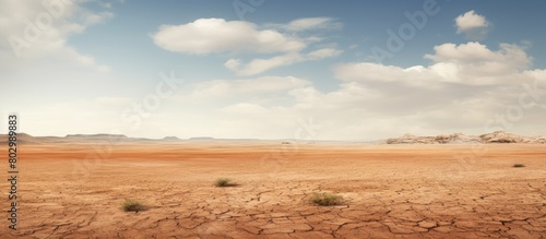 A barren expanse of arid ground with no vegetation resembling a vast desert Copy space image