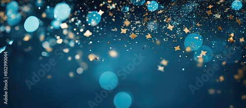 A festive blue background with sparkling confetti stars and bokeh lights creating a vibrant holiday atmosphere The flat lay perspective captured from above offers a copy space for various occasions s