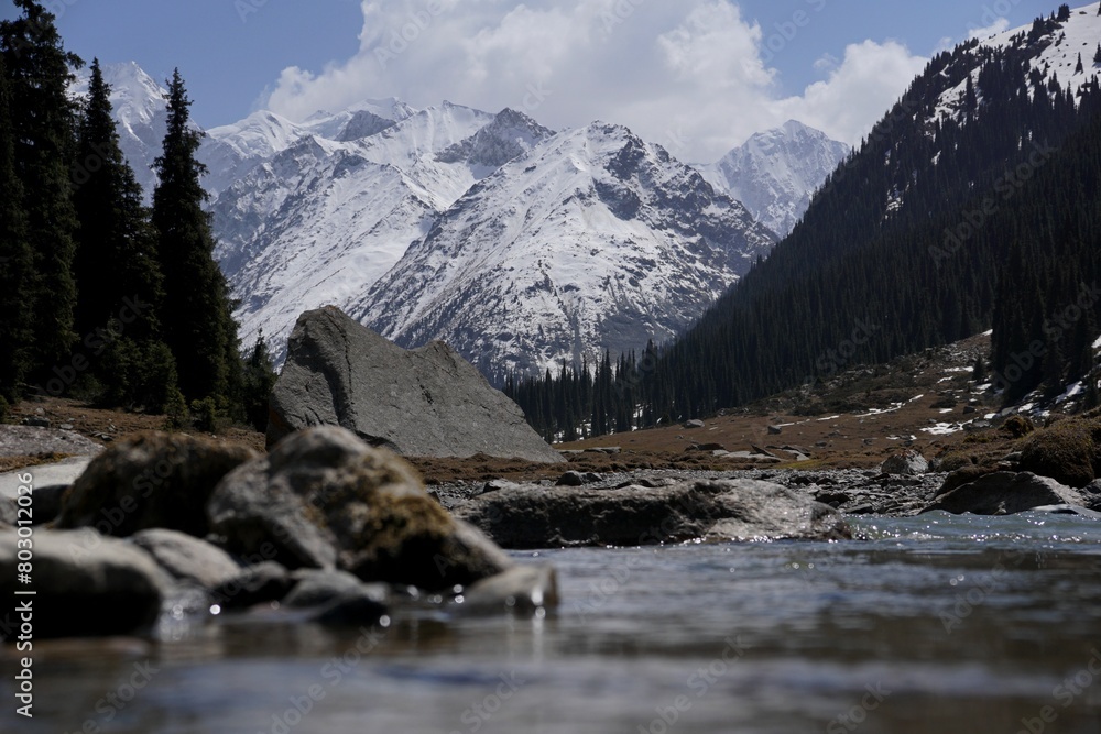 view of the mountain valley, river and snow-capped peaks in the Tien Shan Mountains