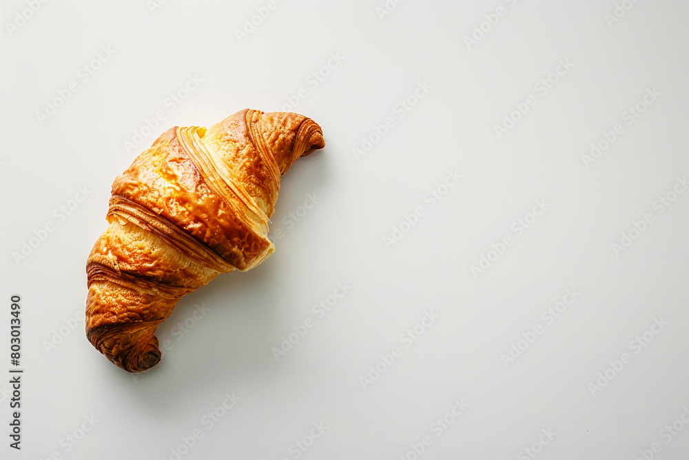 Minimalistic photo of a single croissant on a plain white background, emphasizing the simplicity and beauty of the pastry Minimalistic photo of a single croissant on a plain white background, emphasizing the simplicity and beauty of the pastry