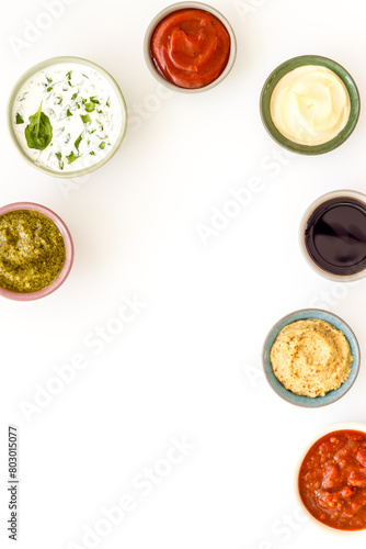 Many different sauces in bowls. Food or cooking background