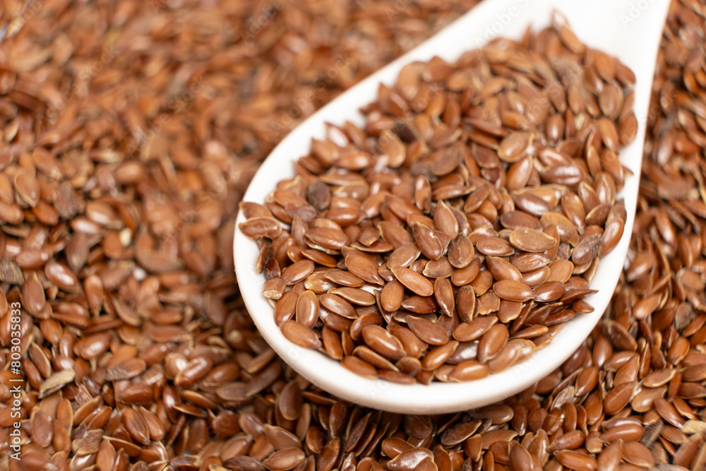 Flax seeds in a spoon macro Flax seeds in a spoon macro