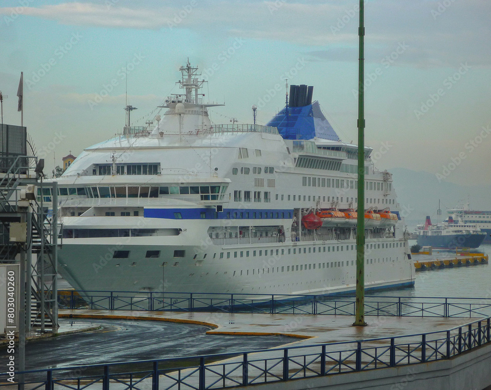 Naklejka premium Small classic cruiseship or cruise ship liner Cristal in Piraeus, Athens cruise port Greece for Greek Islands Aegean summer cruising on family vacation