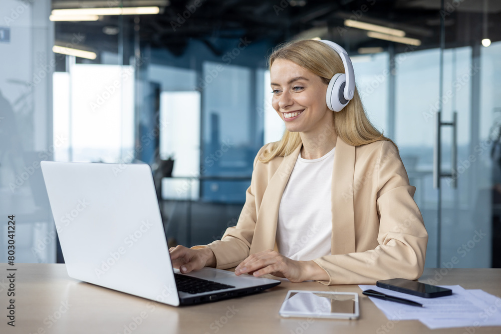 Professional woman working remotely in modern office space Professional woman working remotely in modern office space