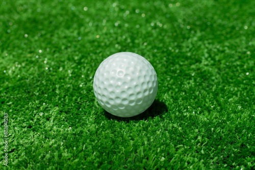 Golf ball on the green background