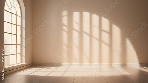 Minimalistic a light beige background for product presentation with light and intricate shadow from the window and wall