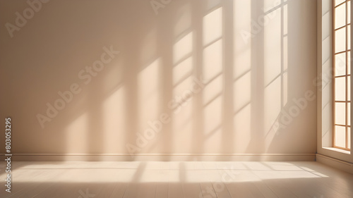Minimalistic a light beige background for product presentation with light and intricate shadow from the window and wall