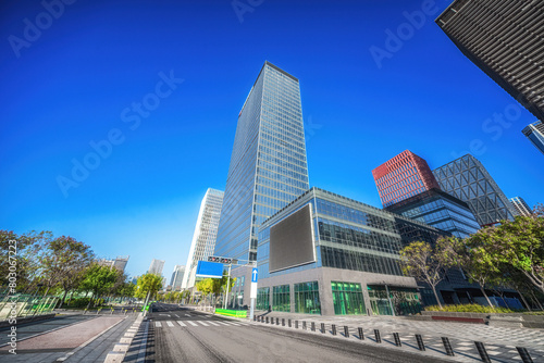 Sunny Urban Corridor with Skyscrapers and Glass Facades