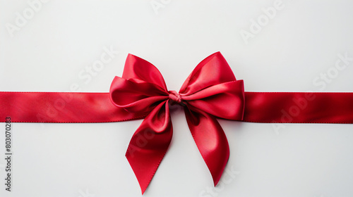 Bow made of red ribbon on white background