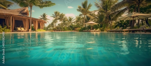 Luxury beach resort near endless swimming pool on tropical island