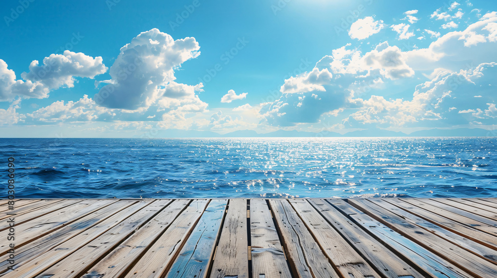 Empty wooden surface against blue sea and sky