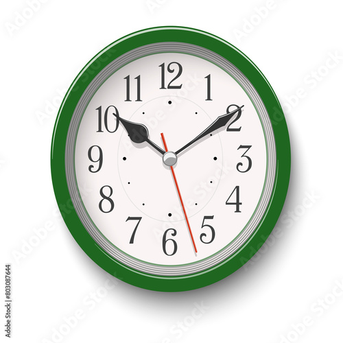 Elegant green oval wall clock placed on white background