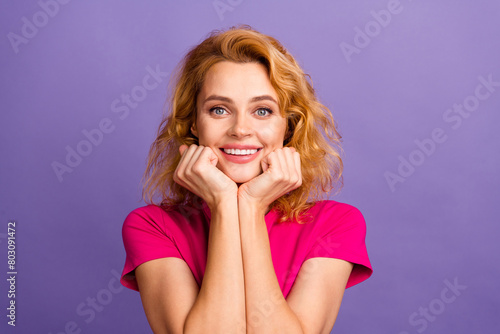 Photo of lovely gorgeous pretty woman wear stylish clothes arms touch cheeks isolated on purple color background