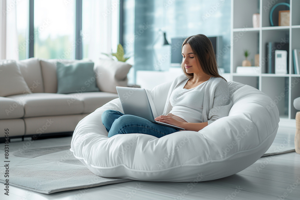“Comfortable Work From Home” A person works on a laptop while seated on a white bean bag, in a bright, modern living space with large windows and cozy furnishings.
“Comfortable Work From Home” A person works on a laptop while seated on a white bean bag, in a bright, modern living space with large windows and cozy furnishings.