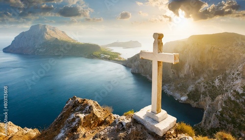 A Marble Cross Perched Upon a Rugged Cliff.
