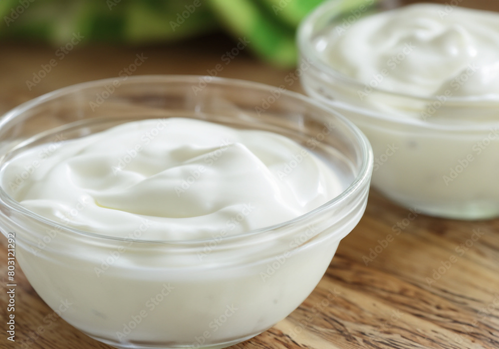 Homemade yogurt or sour cream in bowl Homemade yogurt or sour cream in bowl