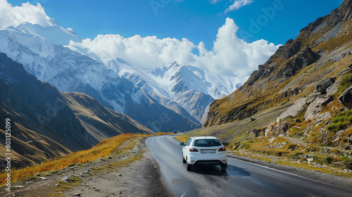The car rushes along the highway through the mountains towards adventure © Taisiia