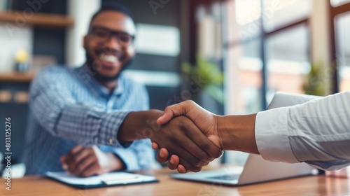 Smiling Businessmen Shaking Hands in a Modern Office Setting