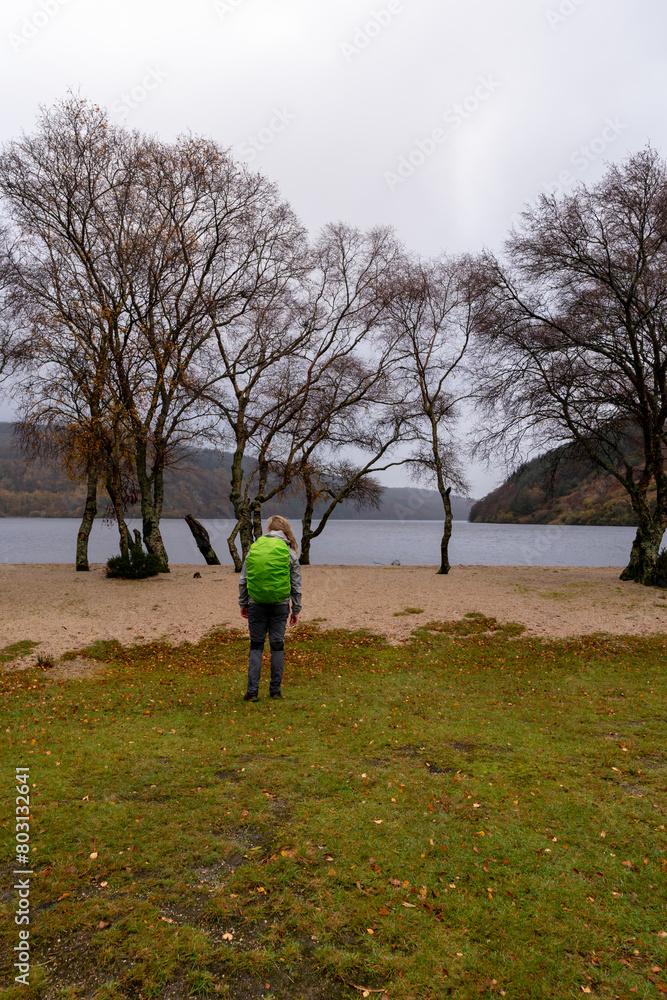 Beautiful view with lake, beach, trees, valley and rocky steep mountain. Bad Depressing weather. Lough Dan lake in Wicklow Mountains, Ireland Beautiful view with lake, beach, trees, valley and rocky steep mountain. Bad Depressing weather. Lough Dan lake in Wicklow Mountains, Ireland