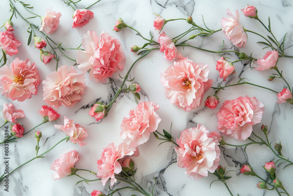 A close up of pink flowers on a marble countertop