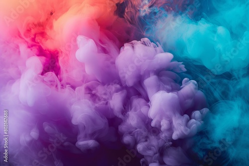 An ethereal cloud of smoke in blue and pink hues against a dark background evoking contemplation photo