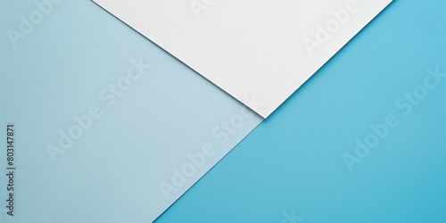 Simplistic composition of blue background with diagonal division and overlaid white paper