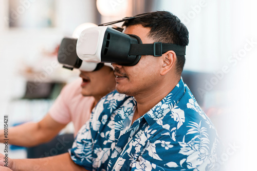 excited happy friends play vr glasses. future gaming technology device make male players enjoy competitive each other for fun. brothers wearing innovation virtual reality headset join in cyber world