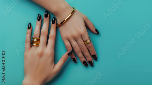 Female hands with trendy dark nail design