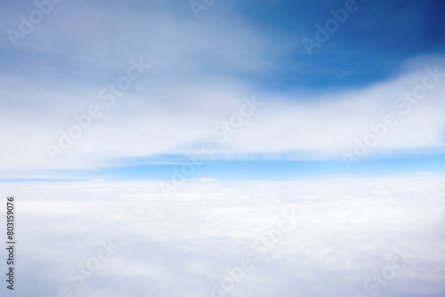  Nature view large soft white clouds on soft blue sky background with sunlight in morning, Panorama view of white cloudy on the plane.