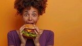 Woman Excitedly Eating Burger