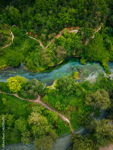 Beautiful turquoise spring Blue Eye or Syri i Kalter near Muzine town in Albania. The spring is very powerful, cold and deep and is a source of a river Bistrice. Tourist attraction of Albania